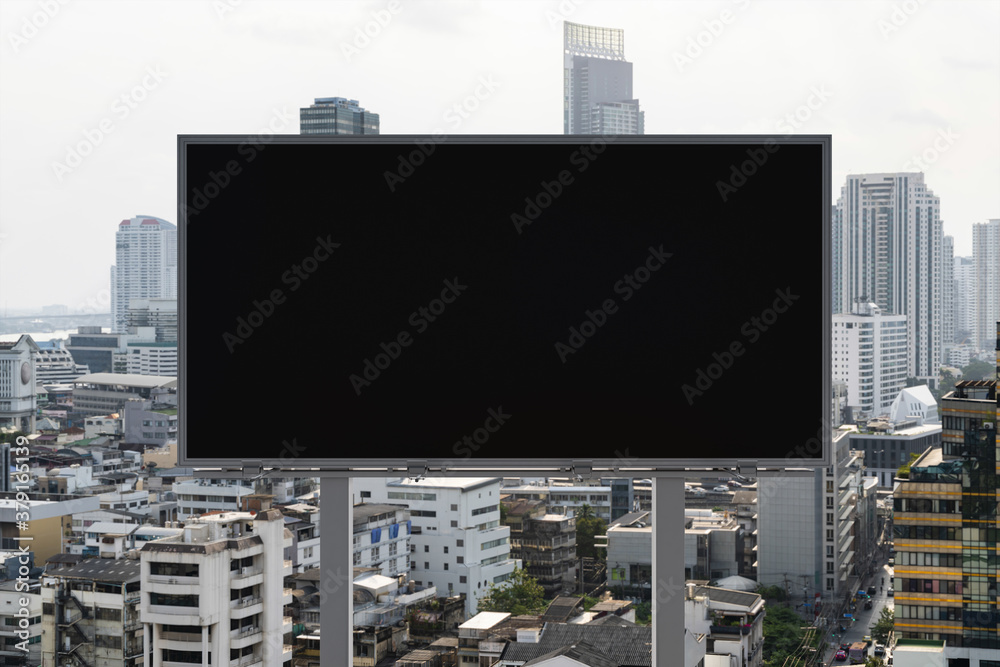 Blank black road billboard with Bangkok cityscape background at day time. Street advertising poster, mock up, 3D rendering. Front view. The concept of marketing communication to promote or sell idea. Blank black road billboard with Bangkok cityscape background at day time. Street advertising poster, mock up, 3D rendering. Front view. The concept of marketing communication to promote or sell idea.