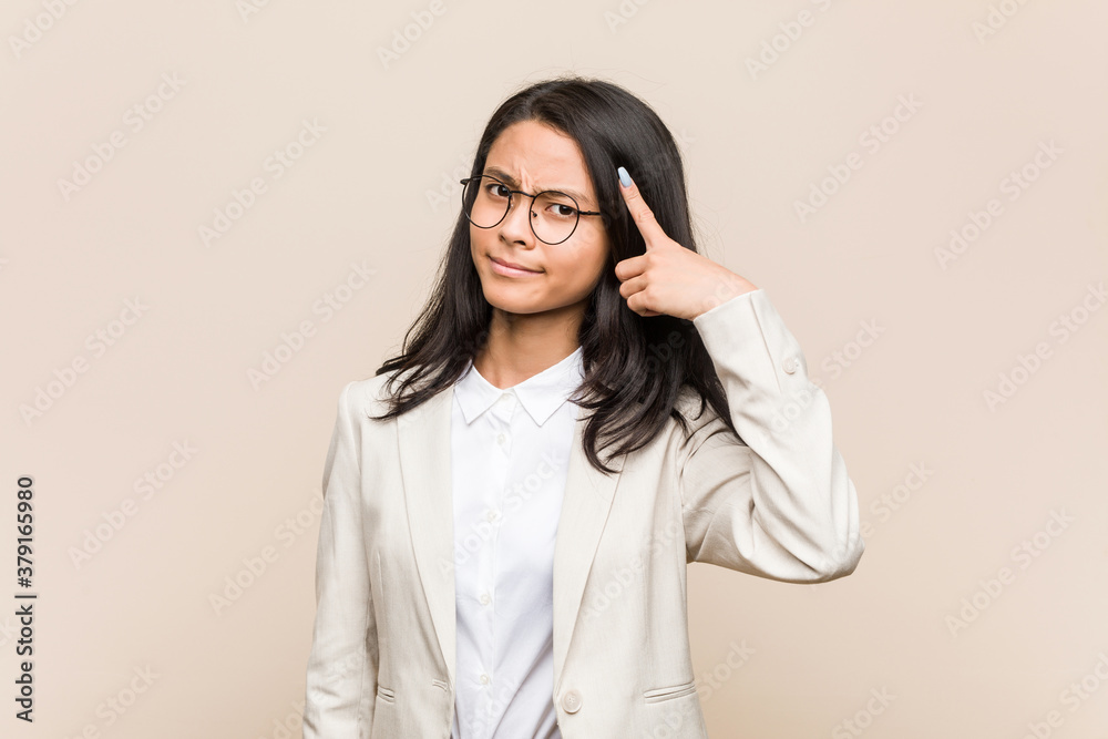 Young business chinese woman showing a disappointment gesture with forefinger. Young business chinese woman showing a disappointment gesture with forefinger.