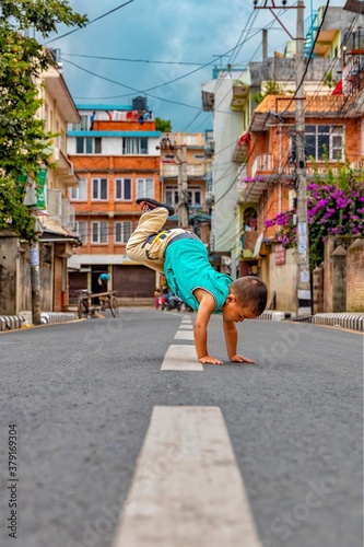 Young boy freestyle break dancing on the street. Hip hop © asiraj