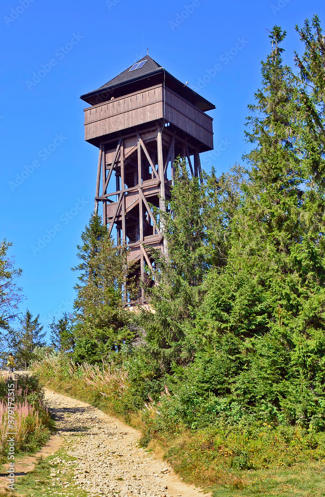 Lookout wooden tower for tourists on the top of the Luban peak in Gorce mountains, Poland Lookout wooden tower for tourists on the top of the Luban peak in Gorce mountains, Poland