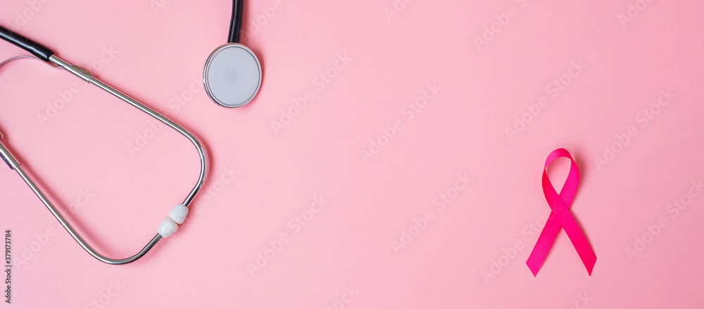 Breast Cancer Awareness, Pink Ribbon with Stethoscope on pink background for supporting people living and illness. Woman Healthcare and World cancer day concept
