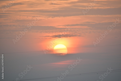 Vintage image of sunset sky with dark dramatic clouds.