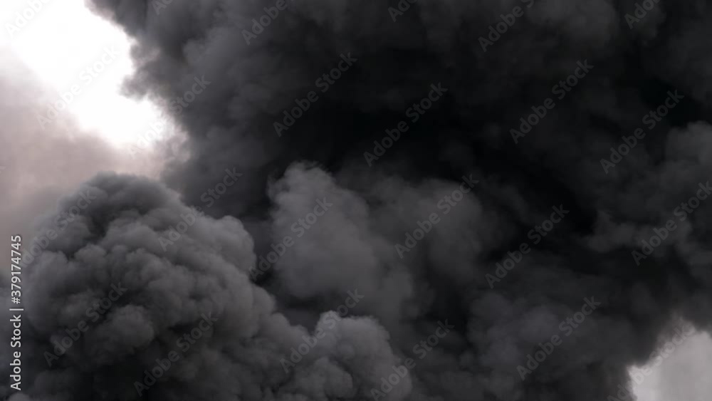 Black, dense and highly polluting smoke, resulting from a plastic fire Black, dense and highly polluting smoke, resulting from a plastic fire