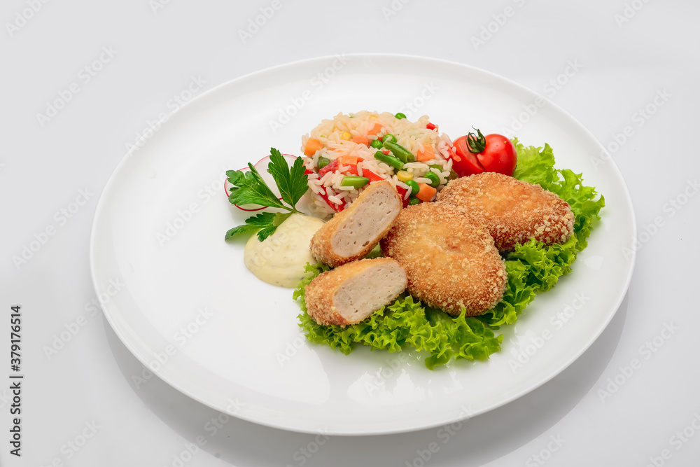 Chicken cutlets in batter with risotto and vegetables Chicken cutlets in batter with risotto and vegetables