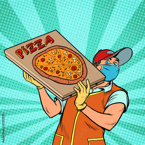 Pizza delivery boy in a protective mask. Street food