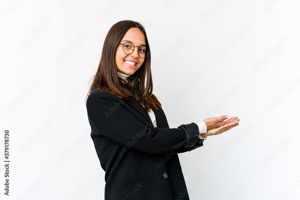 Young mixed race business woman isolated on white background holding a copy space on a palm. Young mixed race business woman isolated on white background holding a copy space on a palm.