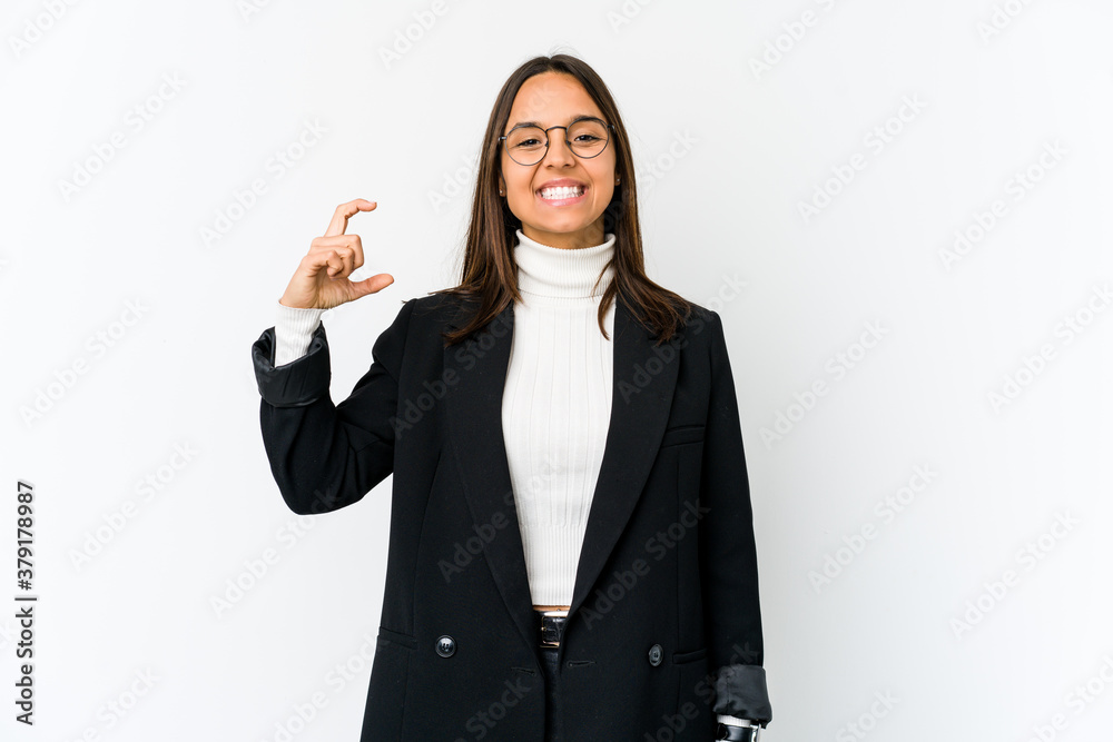 Young mixed race business woman isolated on white background holding something little with forefingers, smiling and confident. Young mixed race business woman isolated on white background holding something little with forefingers, smiling and confident.