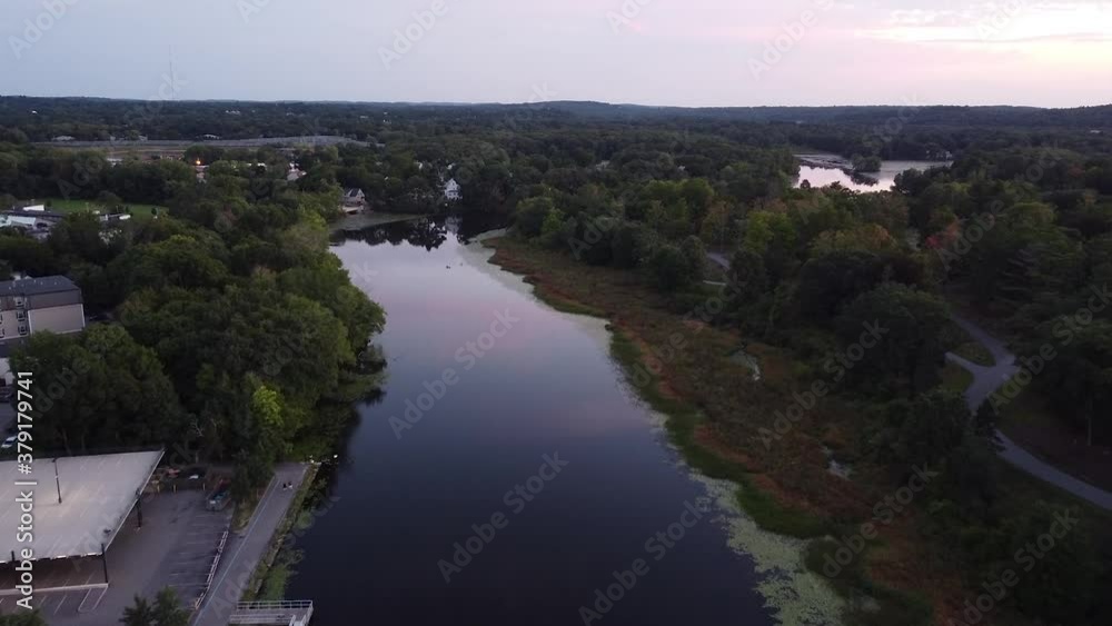 A view of the Charles River in Waltham, Massachusetts at dusk.