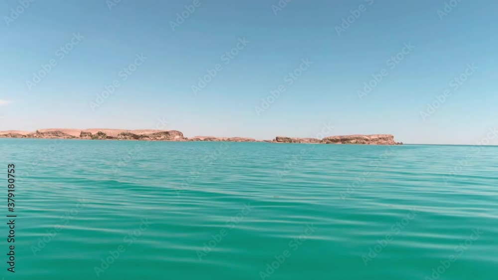 Blue brackish water lake in the middle of desert, filmed by drone Blue brackish water lake in the middle of desert, filmed by drone
