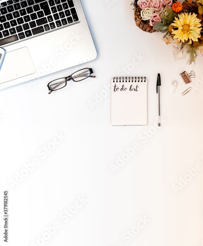 Vertical banner of workspace with laptop and office supplies, with blank copy space