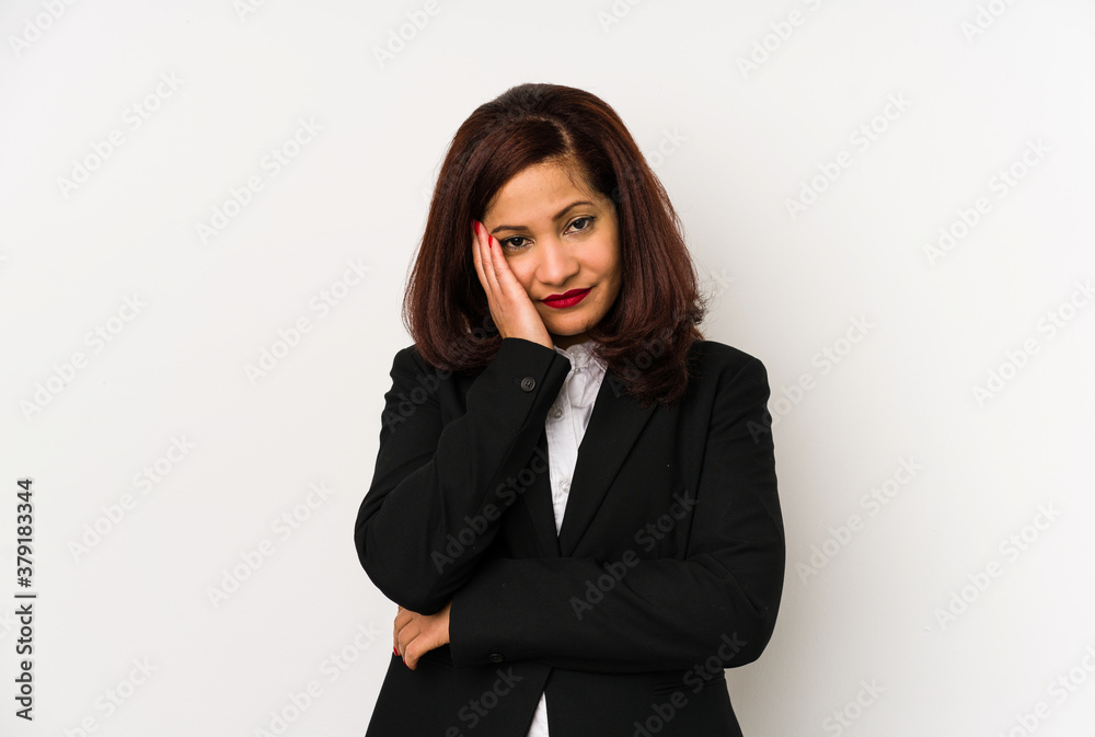 Middle age latin business woman isolated who is bored, fatigued and need a relax day. Middle age latin business woman isolated who is bored, fatigued and need a relax day.