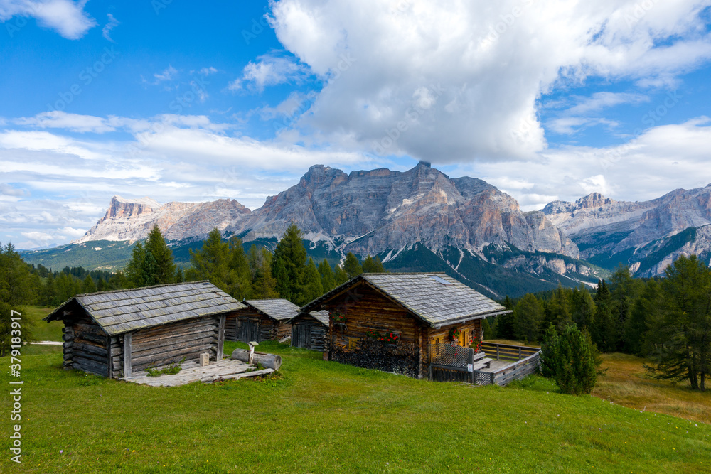 Hut and Piz de Medesc (Medesspitze) and Cima Cunturines (Cunturines-Spitze) beautiful panorama landscape of the dolomites mountains, alpes south tyrol Italy