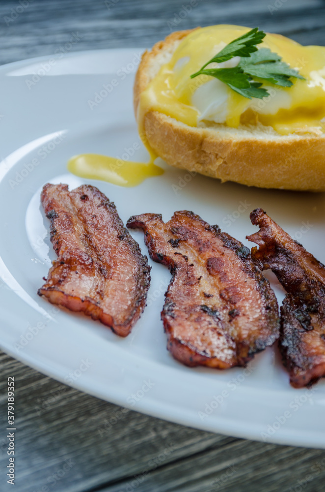 Homemade Benedict Eggs on the plate with souce