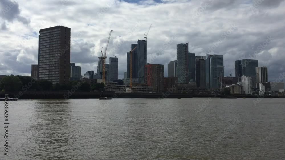 Canary Wharf, London, UK, business district of London viewed from river - stock footage Canary Wharf, London, UK, business district of London viewed from river - stock footage