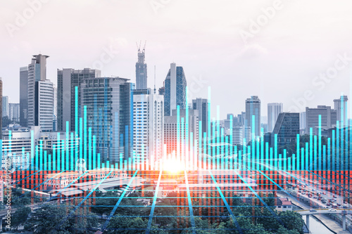 Forex and stock market chart hologram over panorama city view of Kuala Lumpur. KL is the financial center in Malaysia  Asia. The concept of international trading. Double exposure.