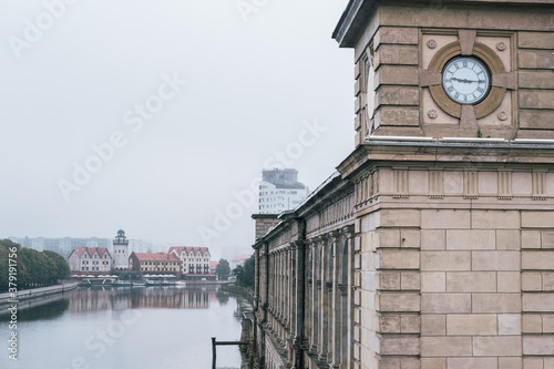 Königsberg Stock Exchange building on Pregolya river and a view of the Fish Village  in Kaliningrad  photo