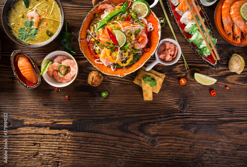 Asian food background with various ingredients on rustic wooden background , top view. Vietnam or Thai cuisine.