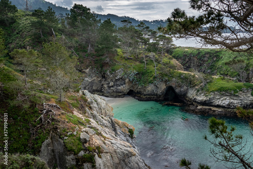 China Cove  as viewed from the hiking trails on cliffs above  at Point Lobos State Natural Reserve  a popular tourist destination in Carmel by the Sea  along the central pacific coast of California. 