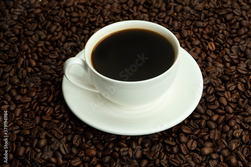 A Cup of coffee in coffee beans. High quality photo