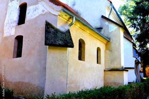 Fortified medieval saxon church in Dealu Frumos, Schoenberg, a village in Merghindeal commune in Sibiu County, Transylvania, Romania. It was first mentioned in a sale-purchase act dating back to 1280. photo