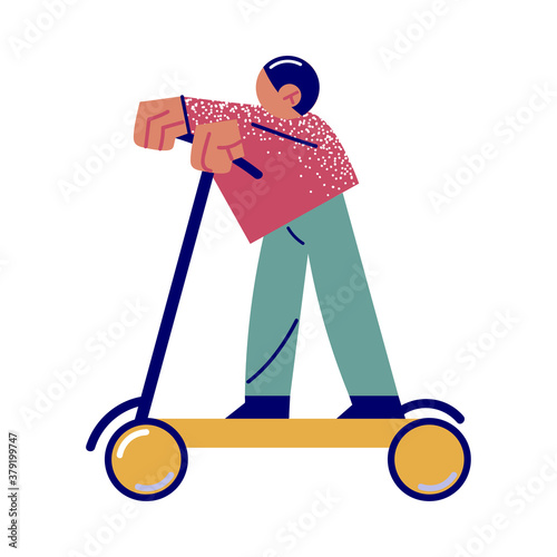 Boy enjoying riding scooter in green city with goof ecology