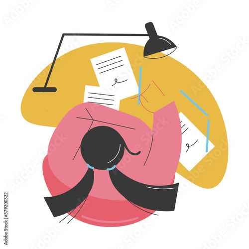 Top view of woman sitting at desk and writing essay or letter