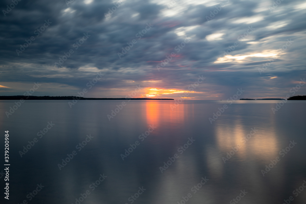 Beautiful golden hours sunset at Lake Superior summer Michigan, Long exposure cloud