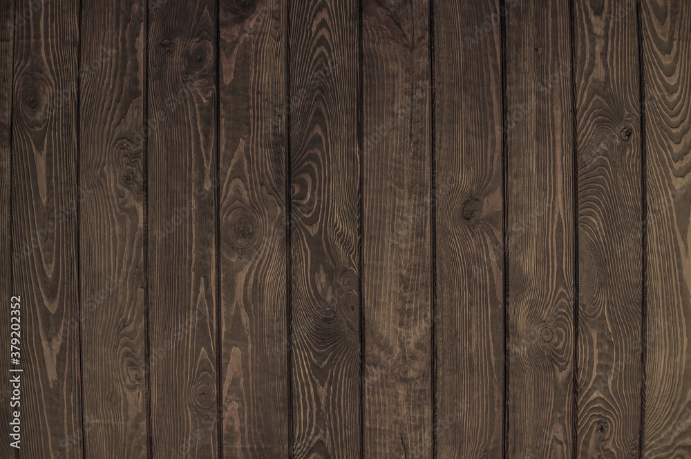 solid dark brown wood background. background of dark wooden boards solid dark brown wood background. background of dark wooden boards