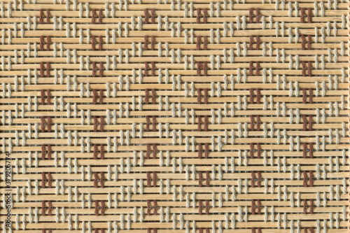 Obraz na plátně Mat made from straw with a pattern of threads
