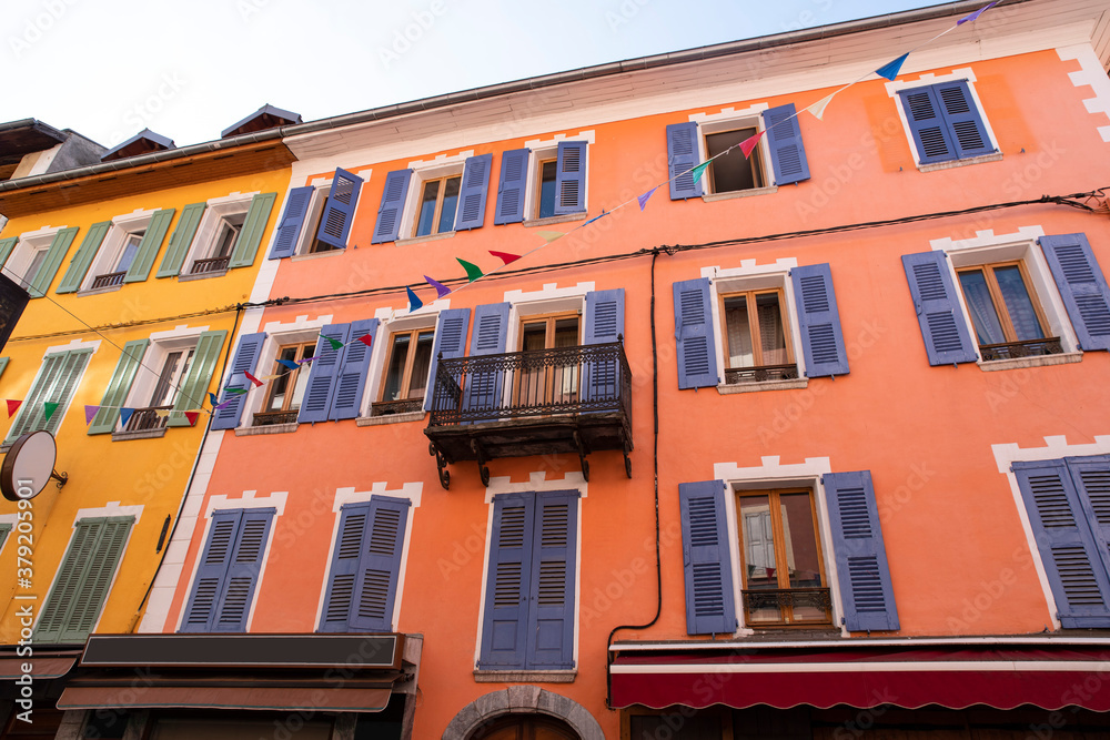 Colorful facade of typical houses of Barcelonnette in France