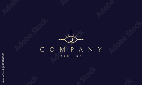 Vector golden logo on which an abstract image of an eye in the form of an alchemical sign.