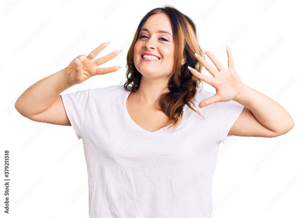 Young beautiful caucasian woman wearing casual white tshirt showing and pointing up with fingers number eight while smiling confident and happy. Young beautiful caucasian woman wearing casual white tshirt showing and pointing up with fingers number eight while smiling confident and happy.