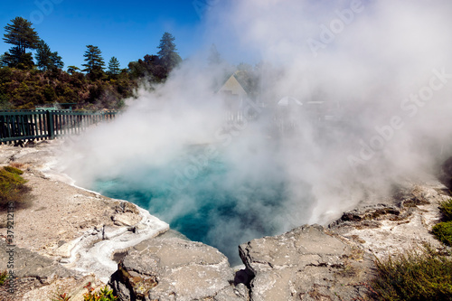 Steam rising from geothermal pool in Maori village