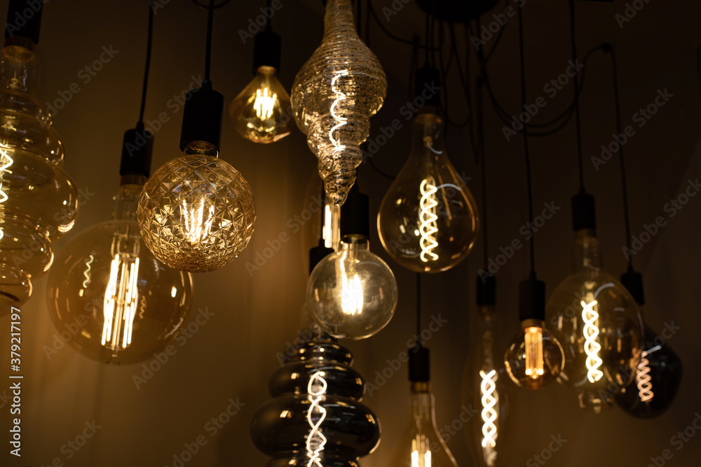 The incandescent lamp is round, oval, creative shape. Set of lighting devices for the home. Background backdrop design The incandescent lamp is round, oval, creative shape. Set of lighting devices for the home. Background backdrop design