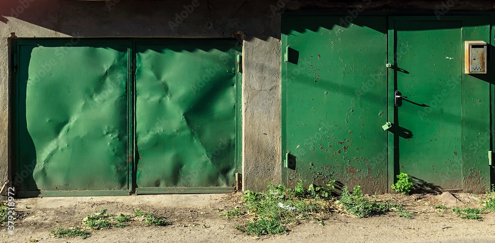 Old fashioned garage door. Hand up and no autimatic garage door. Close- up photo. Old fashioned garage door. Hand up and no autimatic garage door. Close- up photo.