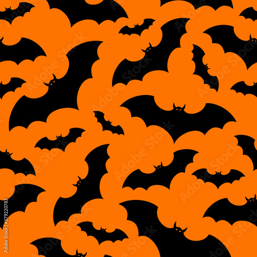 Vector Halloween seamless background with black bats on orange.