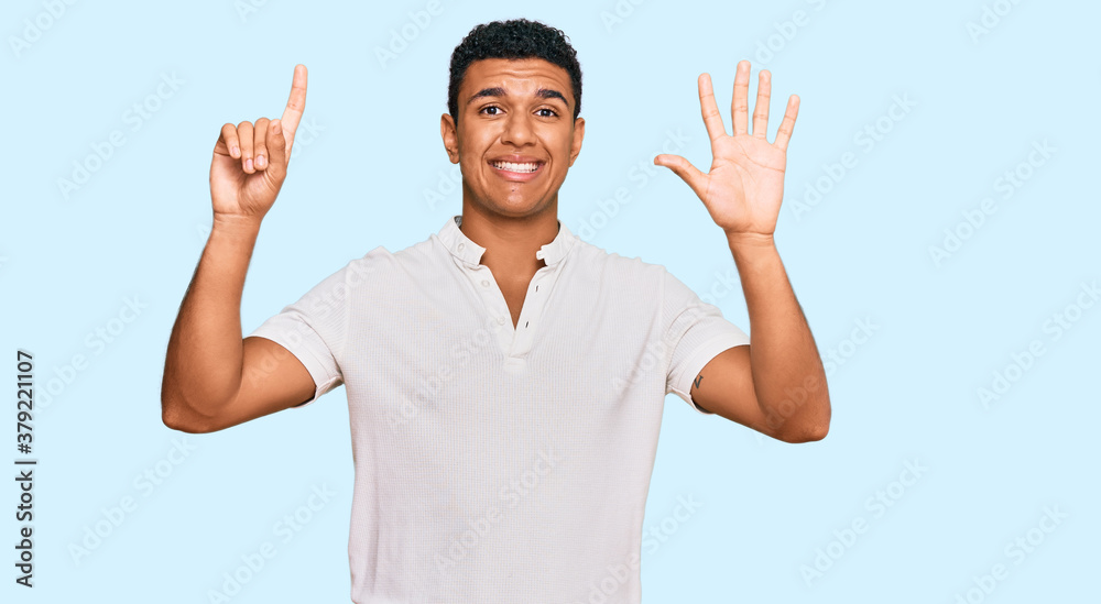 Young arab man wearing casual clothes showing and pointing up with fingers number six while smiling confident and happy. Young arab man wearing casual clothes showing and pointing up with fingers number six while smiling confident and happy.