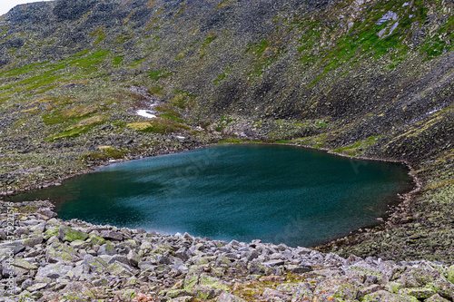 landscape mountain lake on cloudy summer day