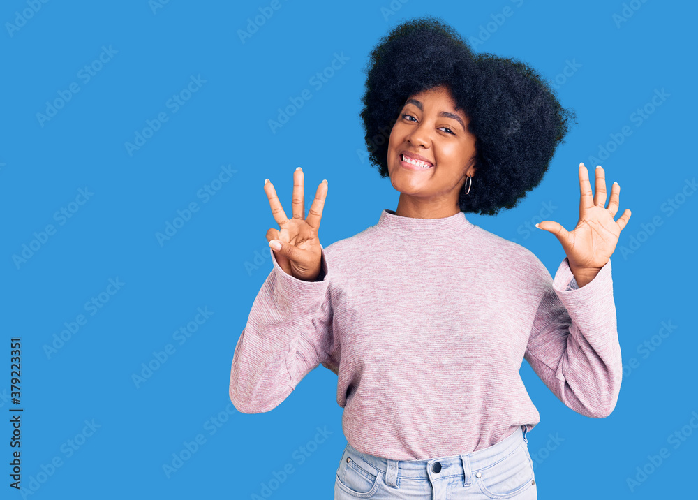 Young african american girl wearing casual clothes showing and pointing up with fingers number eight while smiling confident and happy. Young african american girl wearing casual clothes showing and pointing up with fingers number eight while smiling confident and happy.