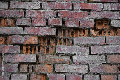 old broken brick wall red