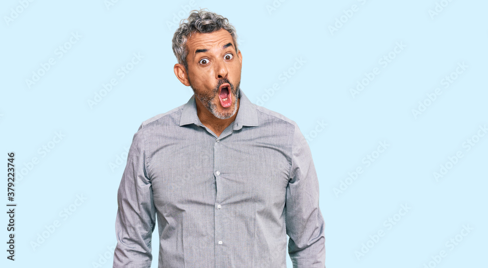 Obraz premium Middle age grey-haired man wearing casual clothes afraid and shocked with surprise expression, fear and excited face.