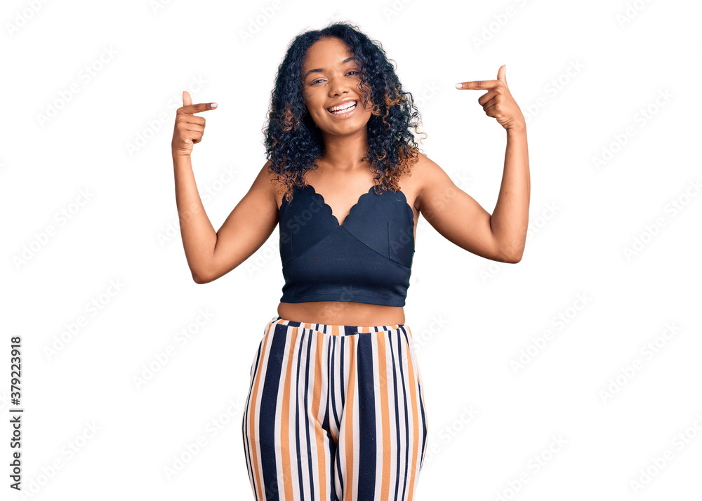 Young african american woman wearing casual clothes looking confident with smile on face, pointing oneself with fingers proud and happy. Young african american woman wearing casual clothes looking confident with smile on face, pointing oneself with fingers proud and happy.