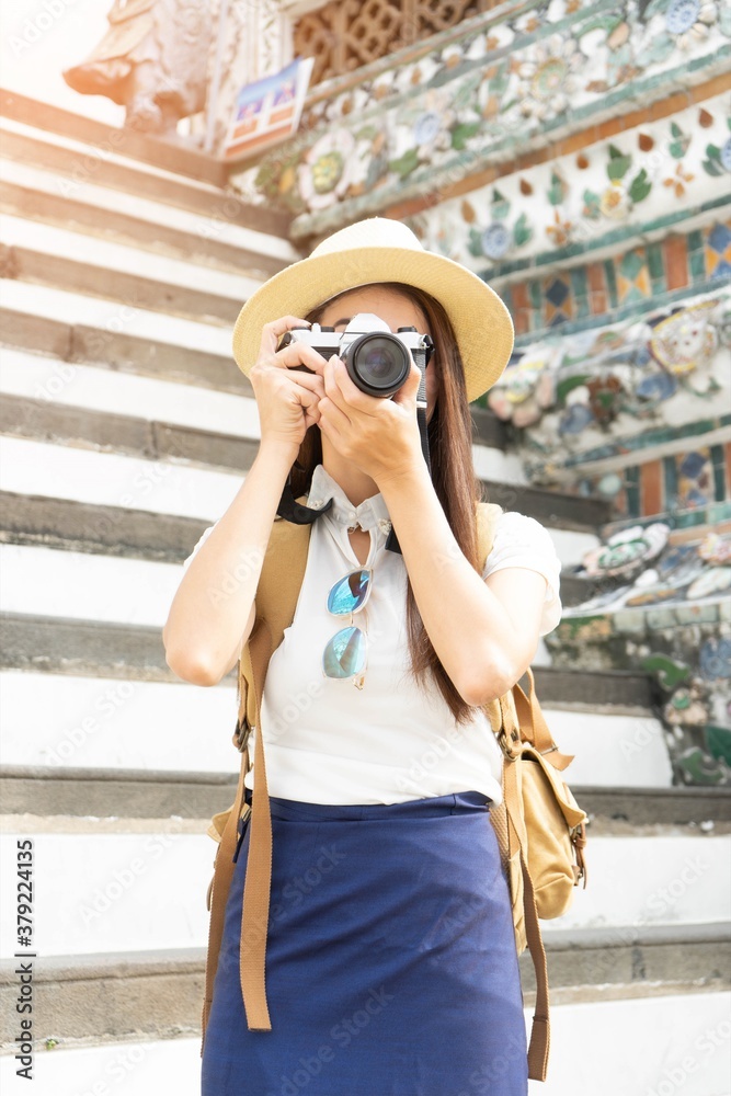 Thai Asian woman taking photo camera tourist with backpack in Thailand - Travel holiday Concept