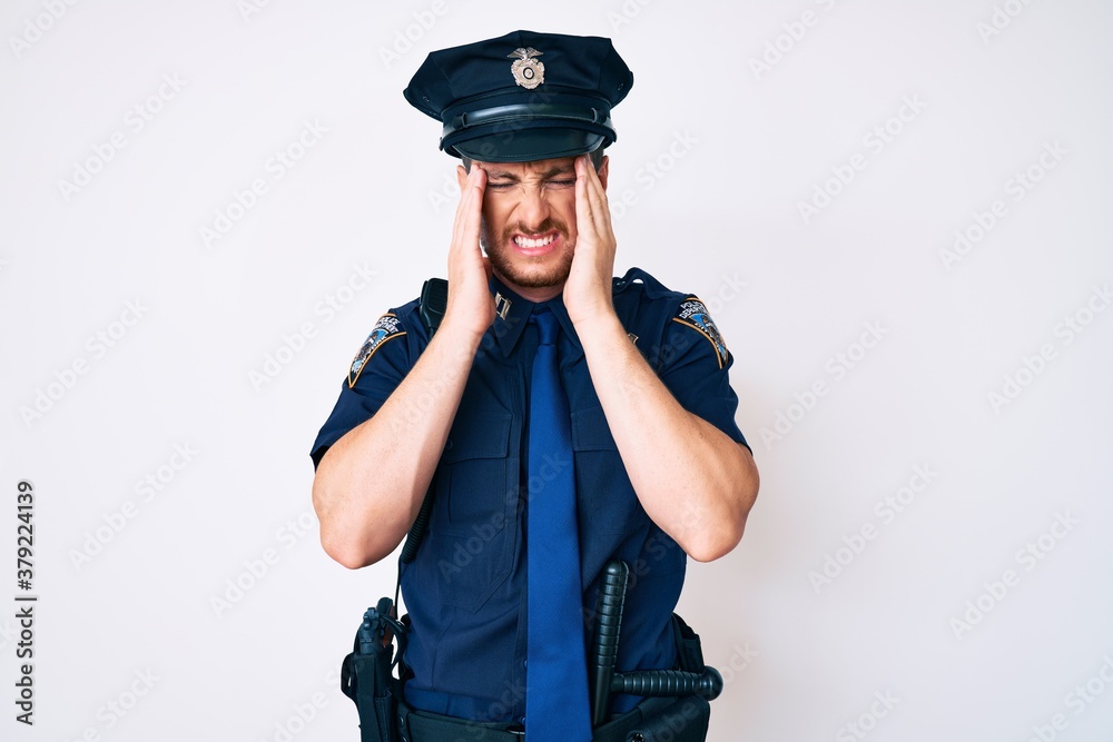 Young caucasian man wearing police uniform with hand on head, headache because stress. suffering migraine. Young caucasian man wearing police uniform with hand on head, headache because stress. suffering migraine.