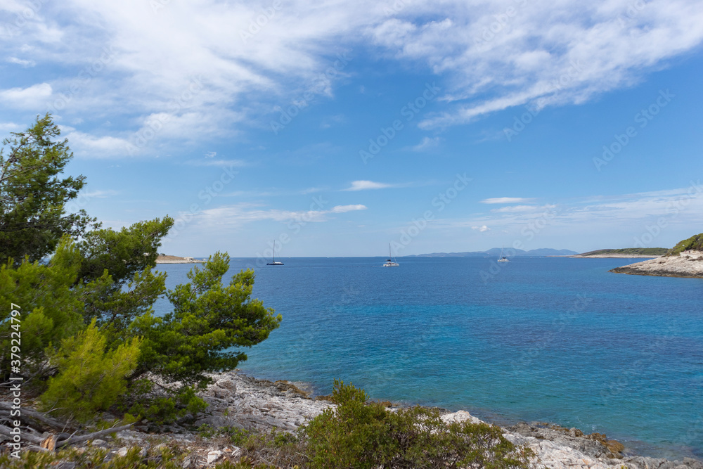 Amazing, turquoise adriatic sea off  the coast of Hvar island, popular sailing destination for tourists