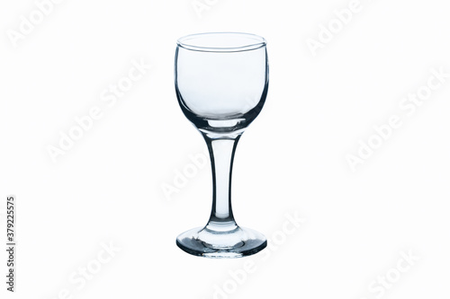 Empty transparent glass for vodka or strong alcohol isolated on white background. Close up view