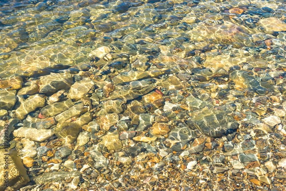 Stones underwater by the sea
