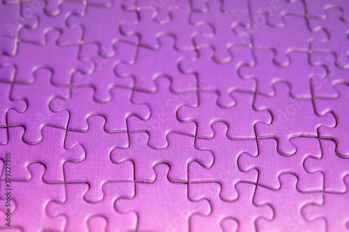 background of correctly placed colored puzzle pieces