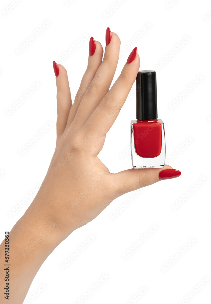 Φωτογραφία closeup of hand of a young woman with long red manicure on nails against white background