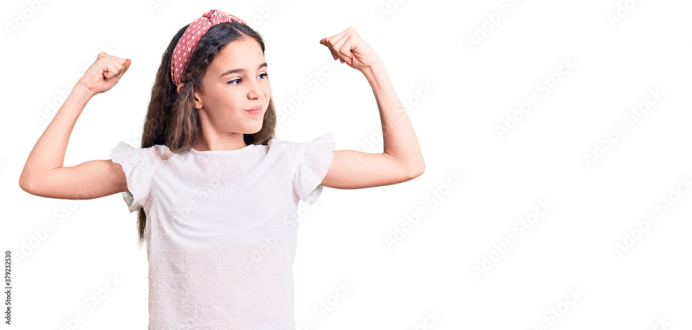 Cute hispanic child girl wearing casual white tshirt showing arms muscles smiling proud. fitness concept. Cute hispanic child girl wearing casual white tshirt showing arms muscles smiling proud. fitness concept.